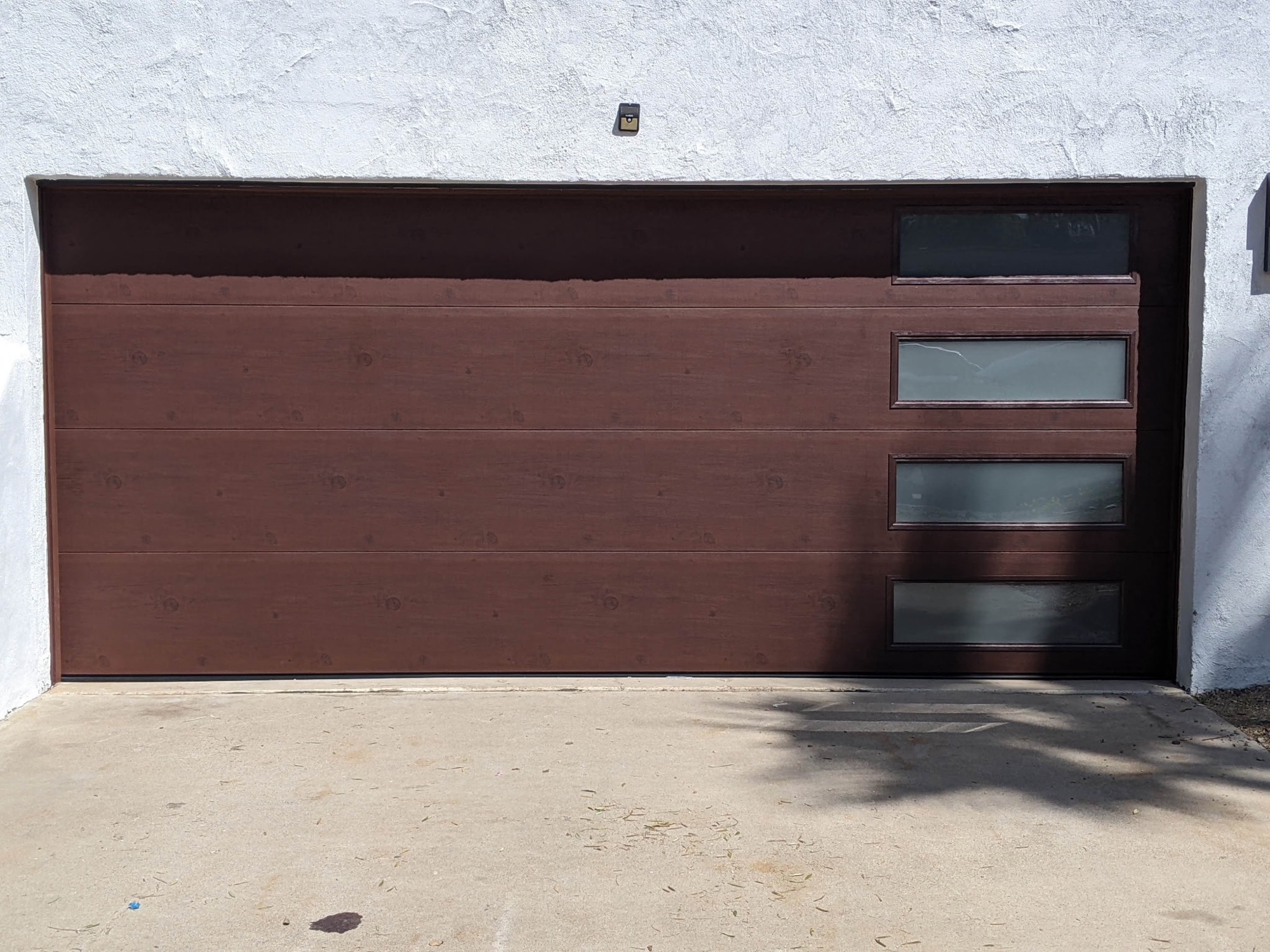 Brown woodgrain door with side-stack glass panels